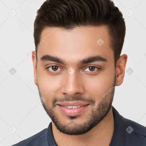 Joyful white young-adult male with short  brown hair and brown eyes