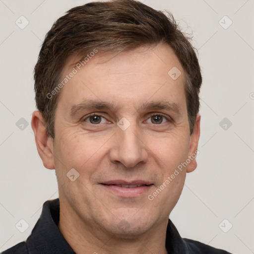 Joyful white adult male with short  brown hair and grey eyes