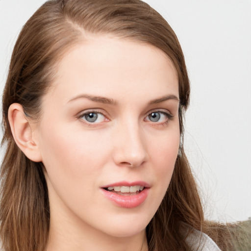 Joyful white young-adult female with long  brown hair and blue eyes