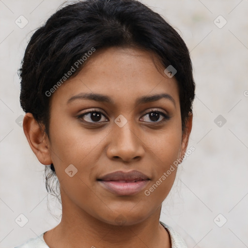 Joyful latino young-adult female with short  brown hair and brown eyes