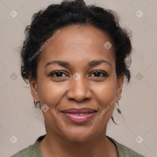 Joyful black adult female with short  brown hair and brown eyes