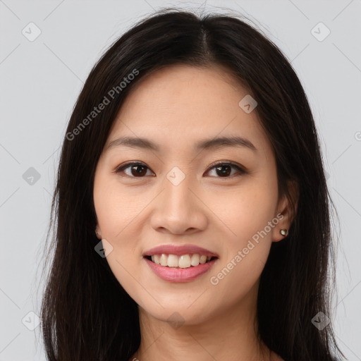 Joyful asian young-adult female with long  brown hair and brown eyes