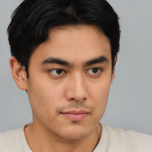 Neutral latino young-adult male with short  brown hair and brown eyes