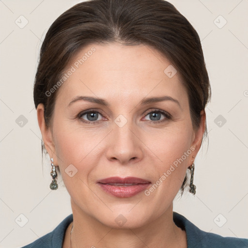 Joyful white adult female with medium  brown hair and grey eyes