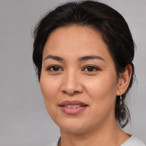 Joyful asian young-adult female with medium  brown hair and brown eyes