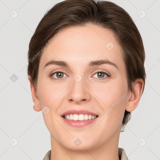 Joyful white young-adult female with short  brown hair and grey eyes