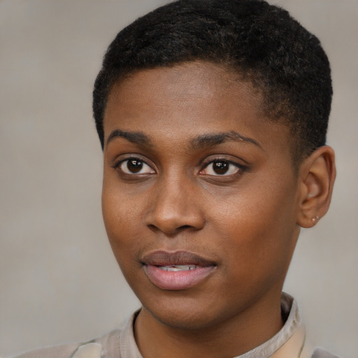 Joyful black young-adult female with short  brown hair and brown eyes