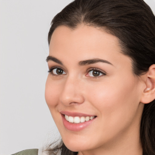 Joyful white young-adult female with medium  brown hair and brown eyes