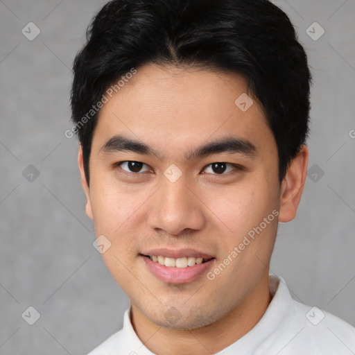 Joyful asian young-adult male with short  black hair and brown eyes