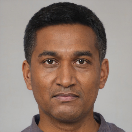 Neutral black adult male with short  black hair and brown eyes