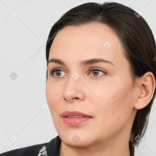 Neutral white young-adult female with medium  brown hair and brown eyes