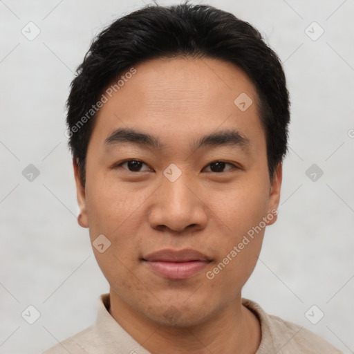 Joyful asian young-adult male with short  black hair and brown eyes