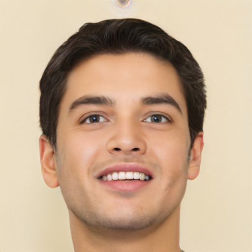 Joyful latino young-adult male with short  black hair and brown eyes