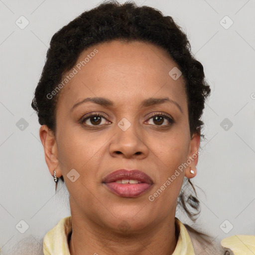 Joyful black adult female with short  brown hair and brown eyes