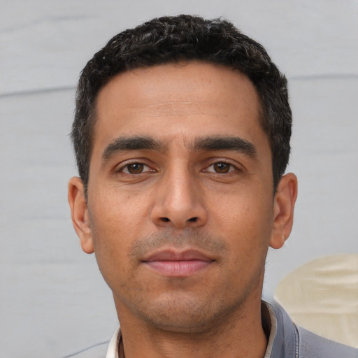 Neutral white young-adult male with short  black hair and brown eyes