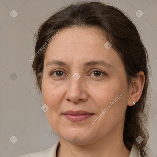 Joyful white adult female with medium  brown hair and brown eyes