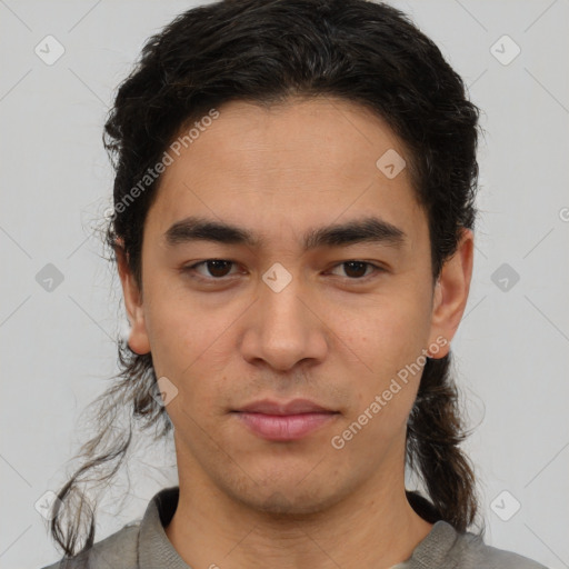 Joyful latino young-adult male with short  brown hair and brown eyes