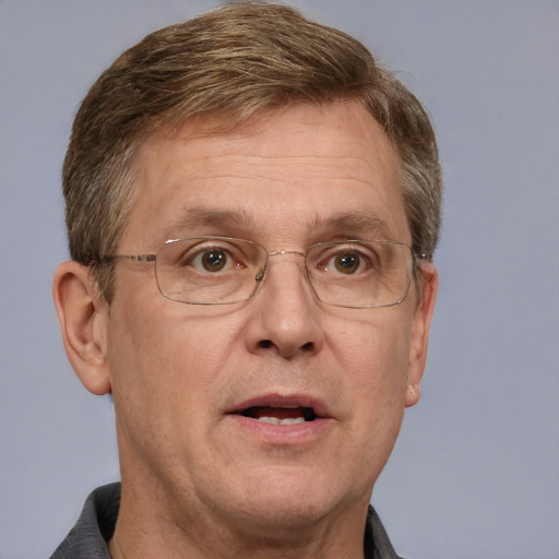 Joyful white middle-aged male with short  brown hair and grey eyes