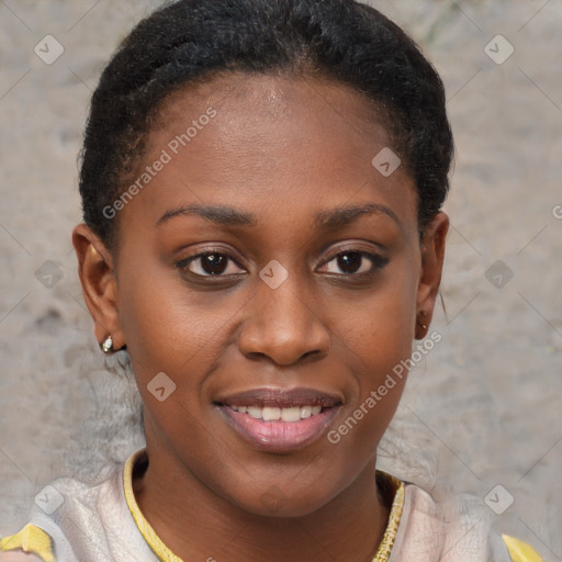 Joyful black young-adult female with short  brown hair and brown eyes