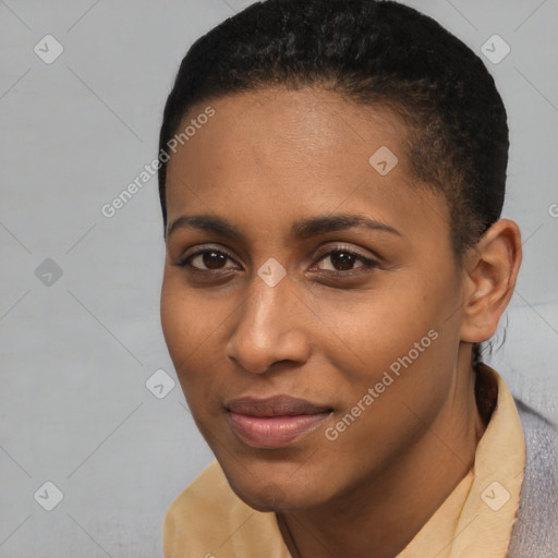 Joyful black young-adult female with short  brown hair and brown eyes