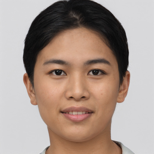 Joyful asian young-adult female with short  brown hair and brown eyes