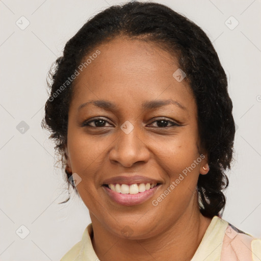 Joyful latino adult female with medium  brown hair and brown eyes