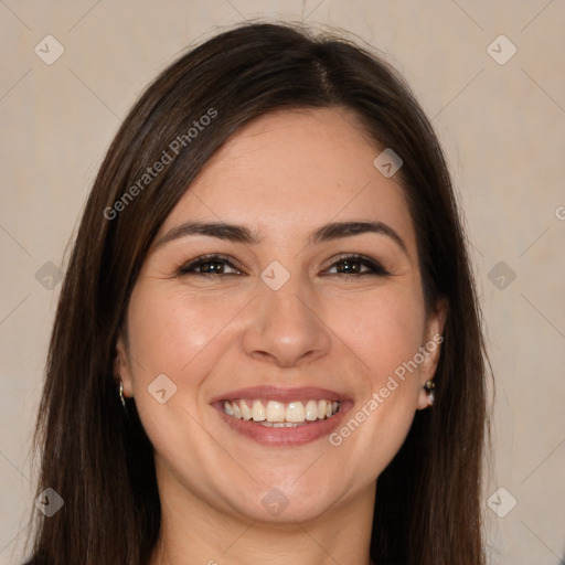 Joyful white young-adult female with long  brown hair and brown eyes