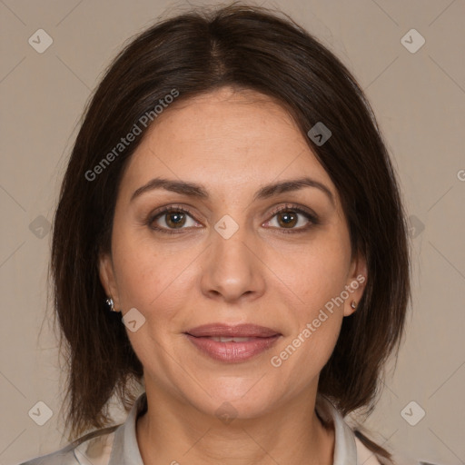 Joyful white adult female with medium  brown hair and brown eyes