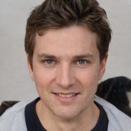 Joyful white adult male with short  brown hair and brown eyes