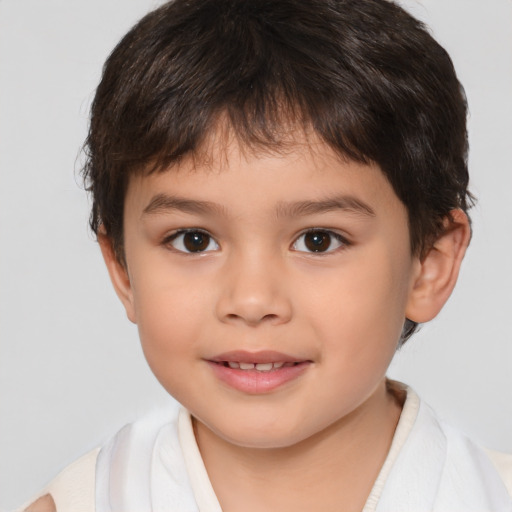 Joyful white child male with short  brown hair and brown eyes