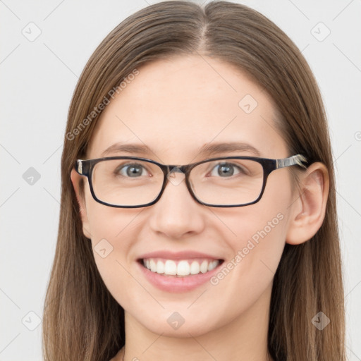 Joyful white young-adult female with long  brown hair and blue eyes