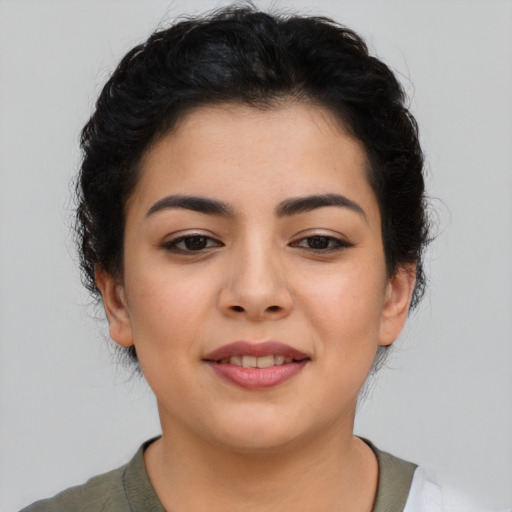 Joyful asian young-adult female with short  black hair and brown eyes