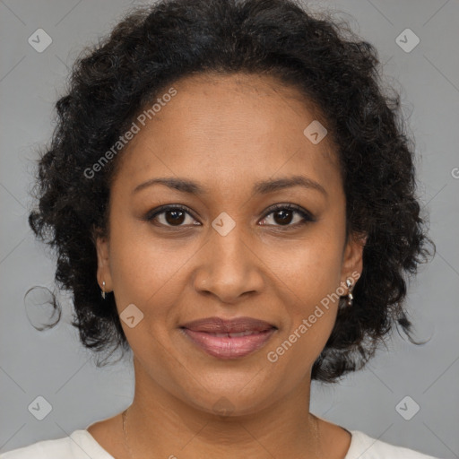 Joyful black adult female with medium  brown hair and brown eyes