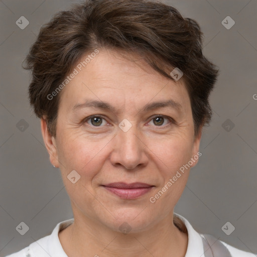 Joyful white adult female with short  brown hair and brown eyes