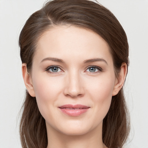 Joyful white young-adult female with long  brown hair and grey eyes