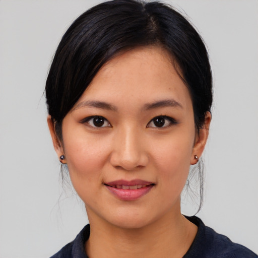 Joyful white young-adult female with medium  black hair and brown eyes
