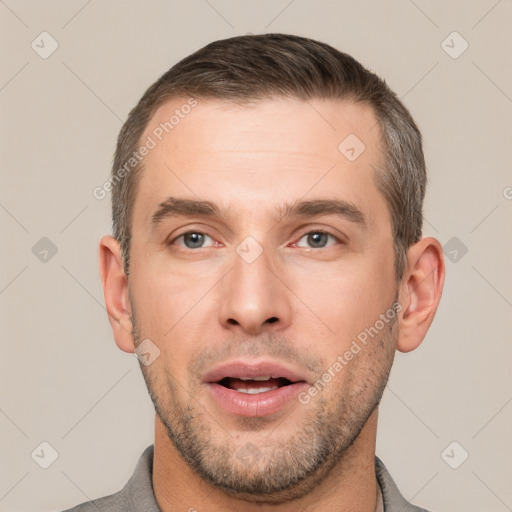 Joyful white young-adult male with short  brown hair and brown eyes