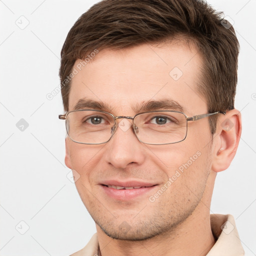 Joyful white adult male with short  brown hair and brown eyes