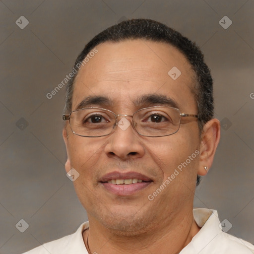 Joyful white adult male with short  black hair and brown eyes