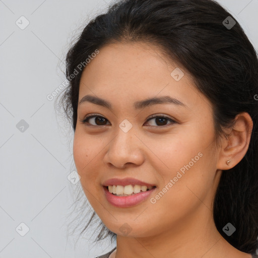 Joyful asian young-adult female with long  brown hair and brown eyes