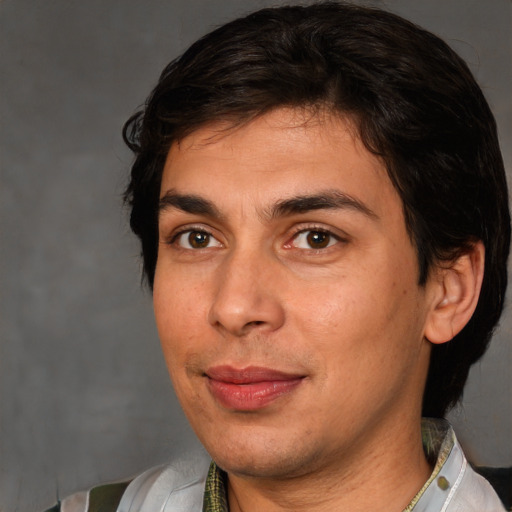 Joyful white young-adult male with medium  brown hair and brown eyes