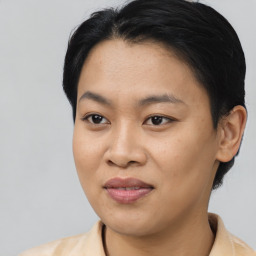 Joyful asian young-adult female with short  black hair and brown eyes