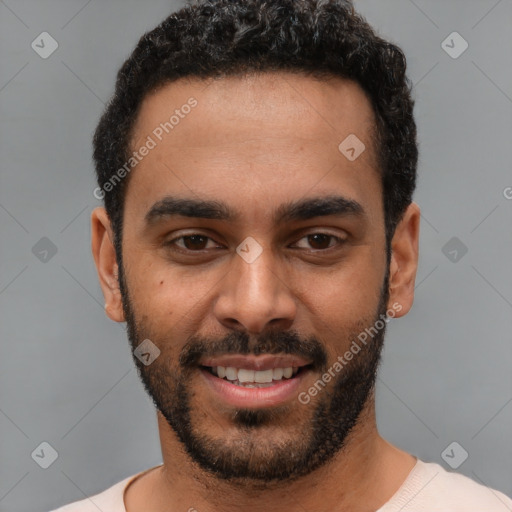 Joyful white young-adult male with short  black hair and brown eyes