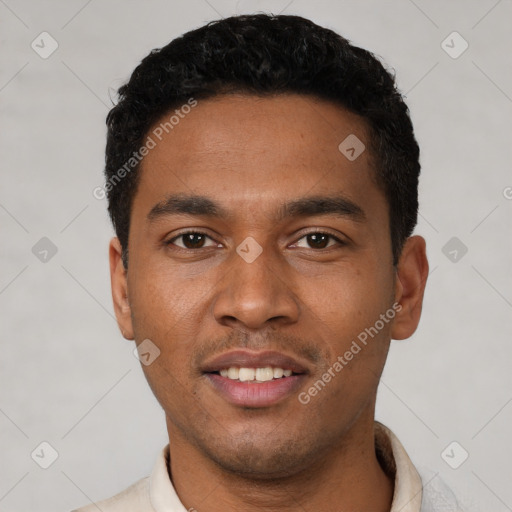 Joyful latino young-adult male with short  black hair and brown eyes