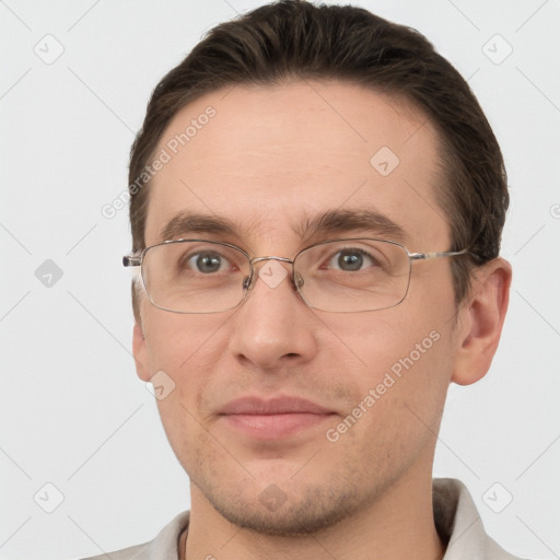 Joyful white adult male with short  brown hair and grey eyes