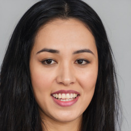 Joyful asian young-adult female with long  brown hair and brown eyes