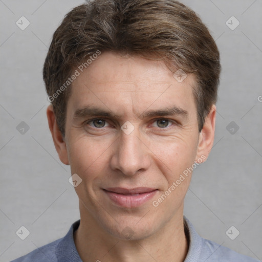 Joyful white adult male with short  brown hair and grey eyes