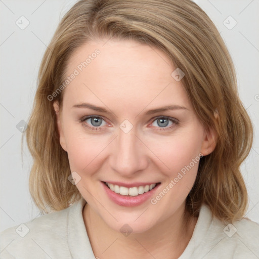 Joyful white young-adult female with medium  brown hair and blue eyes