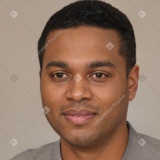 Joyful black young-adult male with short  black hair and brown eyes