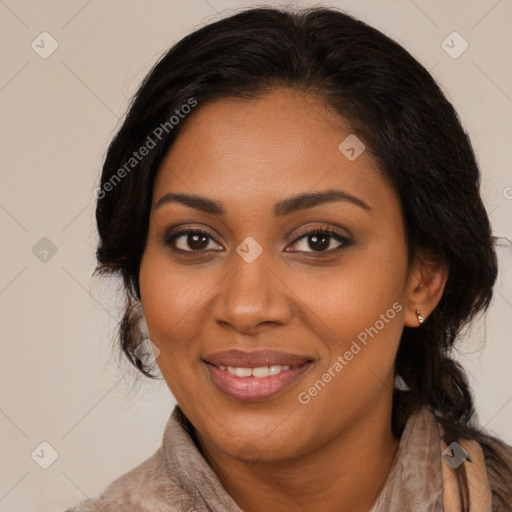 Joyful black young-adult female with long  brown hair and brown eyes